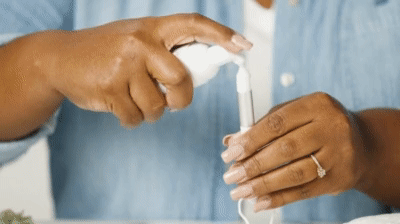 woman demonstrating how to clean lash extensions