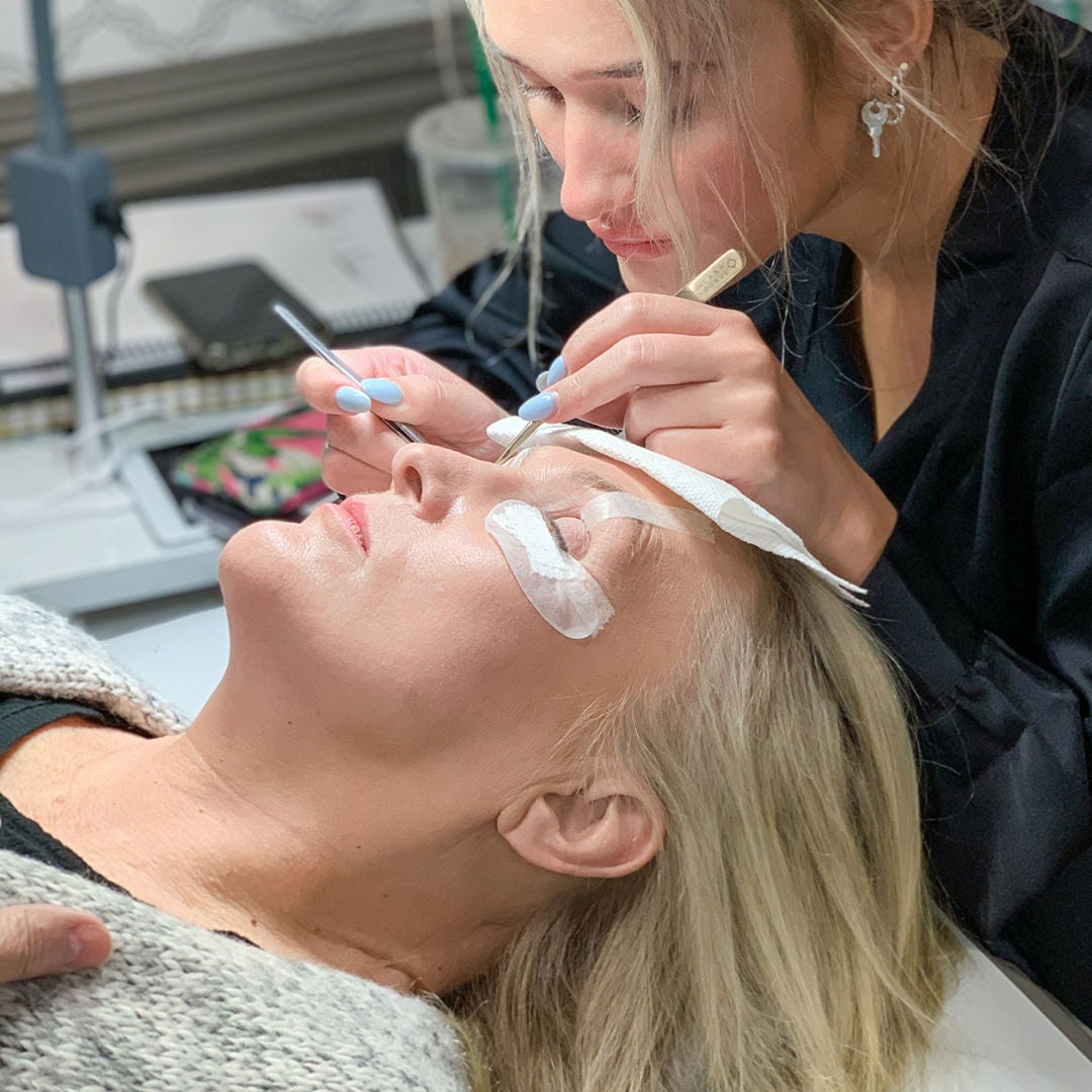 blonde woman getting lash extensions